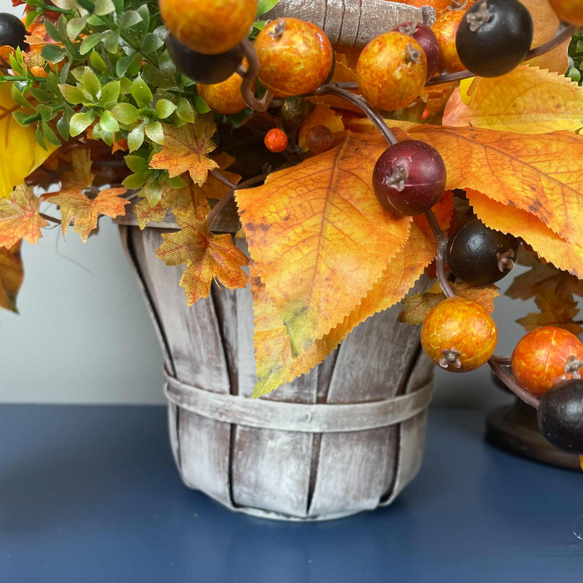 Fall Pumpkin Centerpiece with Orange Flowers in Whitewashed Basket