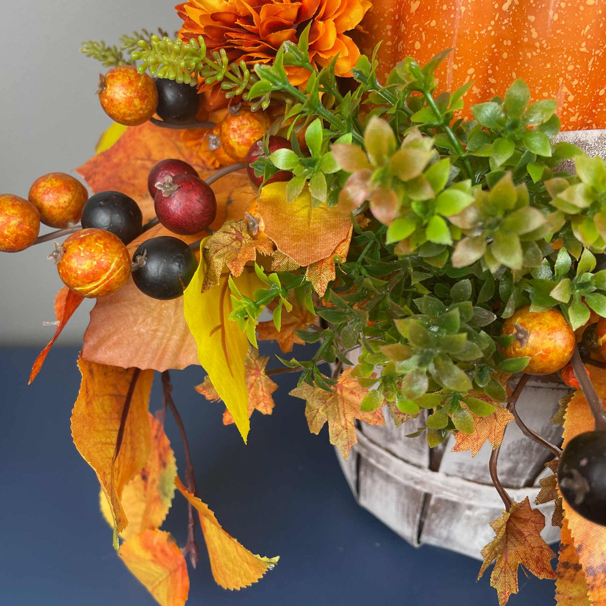 Fall Pumpkin Centerpiece with Orange Flowers in Whitewashed Basket