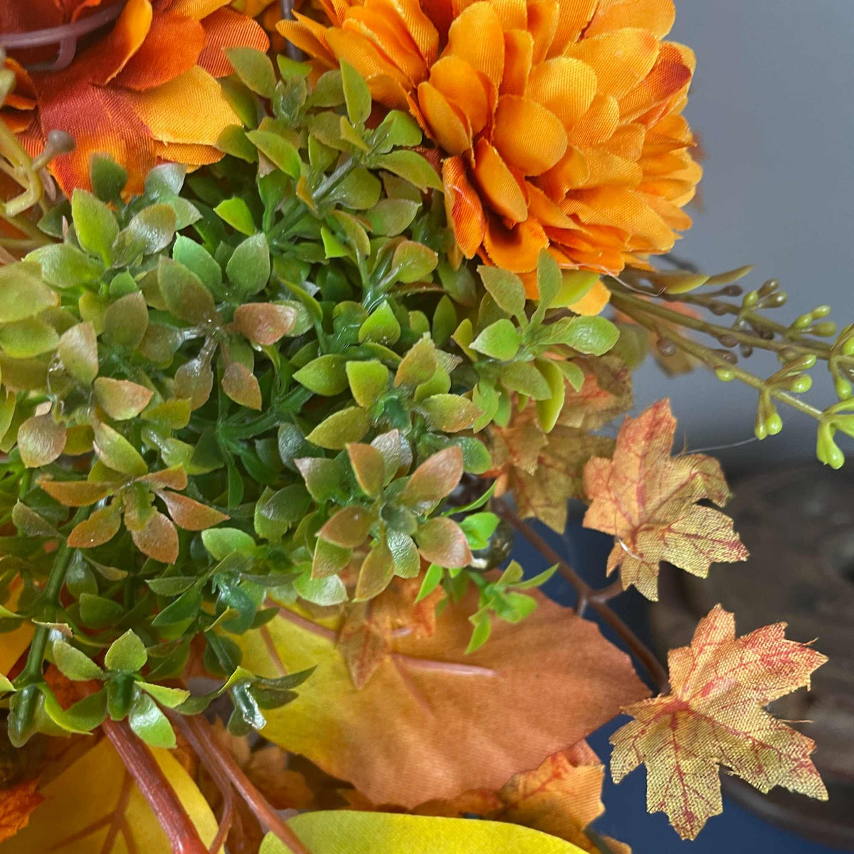 Fall Pumpkin Centerpiece with Orange Flowers in Whitewashed Basket