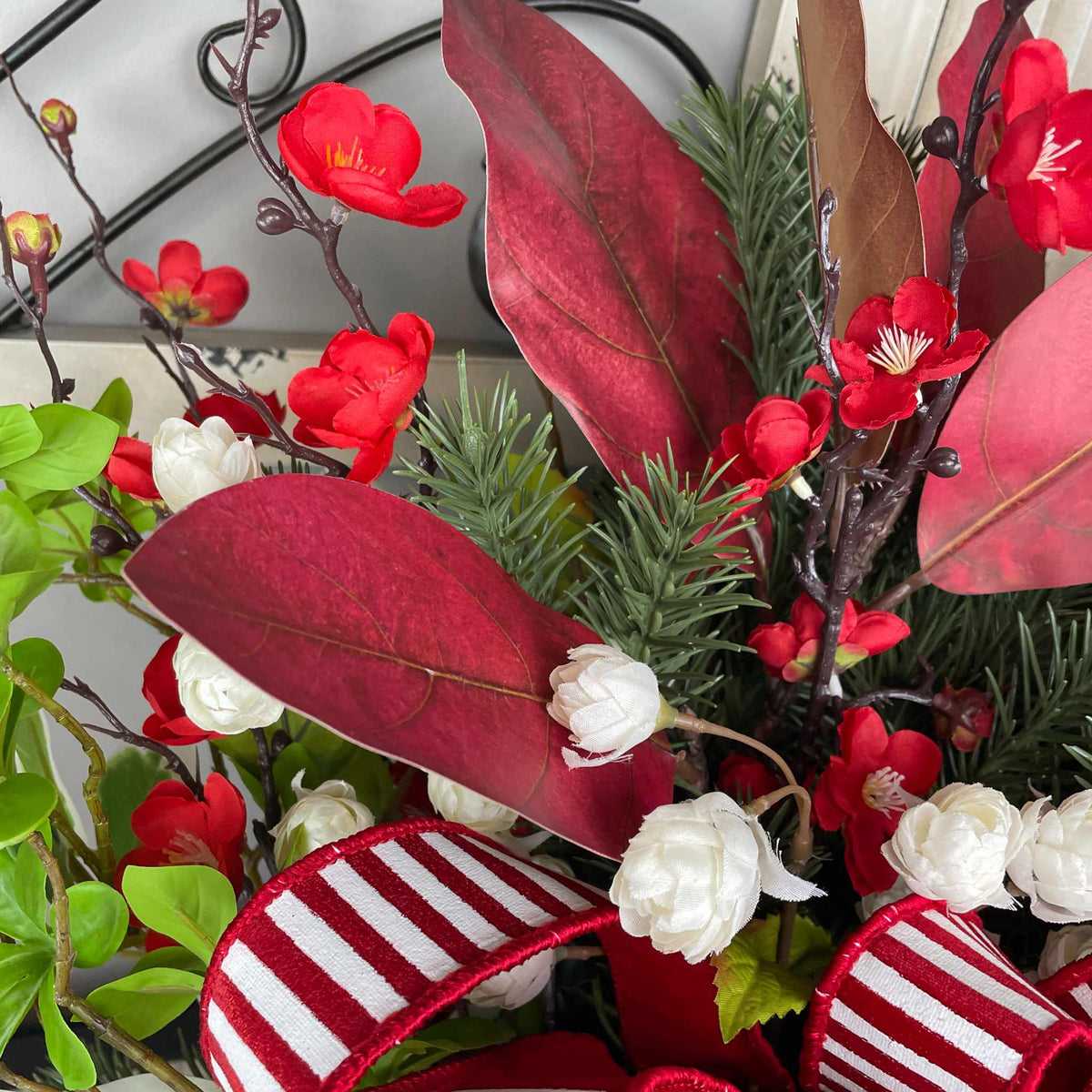 Christmas Centerpiece with Red Velvet Magnolias and Pine Greenery