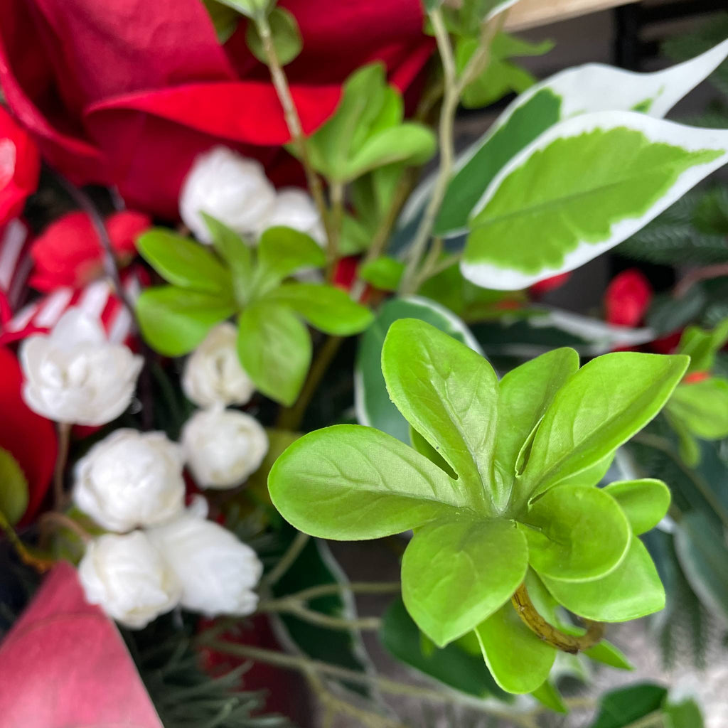 Christmas Centerpiece with Red Velvet Magnolias and Pine Greenery