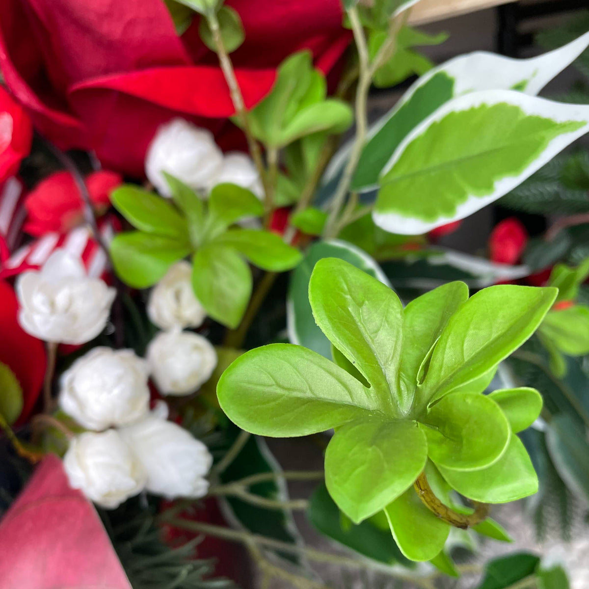 Christmas Centerpiece with Red Velvet Magnolias and Pine Greenery