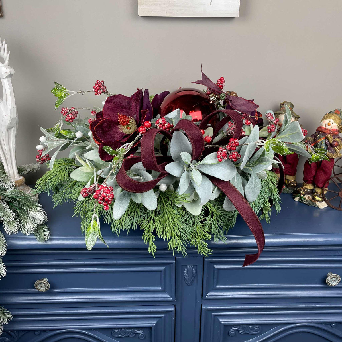 Christmas Centerpiece with Plum Magnolias and Burgundy Ornament Tray