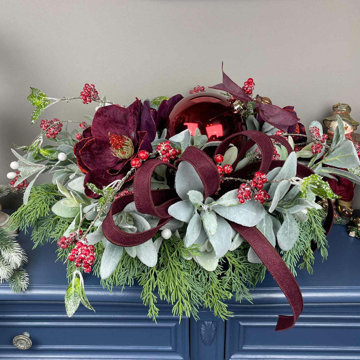 Christmas Centerpiece with Plum Magnolias and Burgundy Ornament Tray