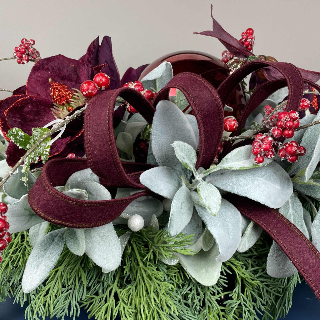 Christmas Centerpiece with Plum Magnolias and Burgundy Ornament Tray