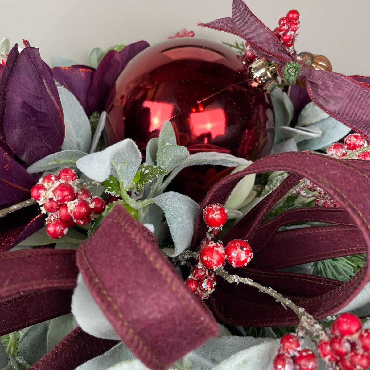 Christmas Centerpiece with Plum Magnolias and Burgundy Ornament Tray