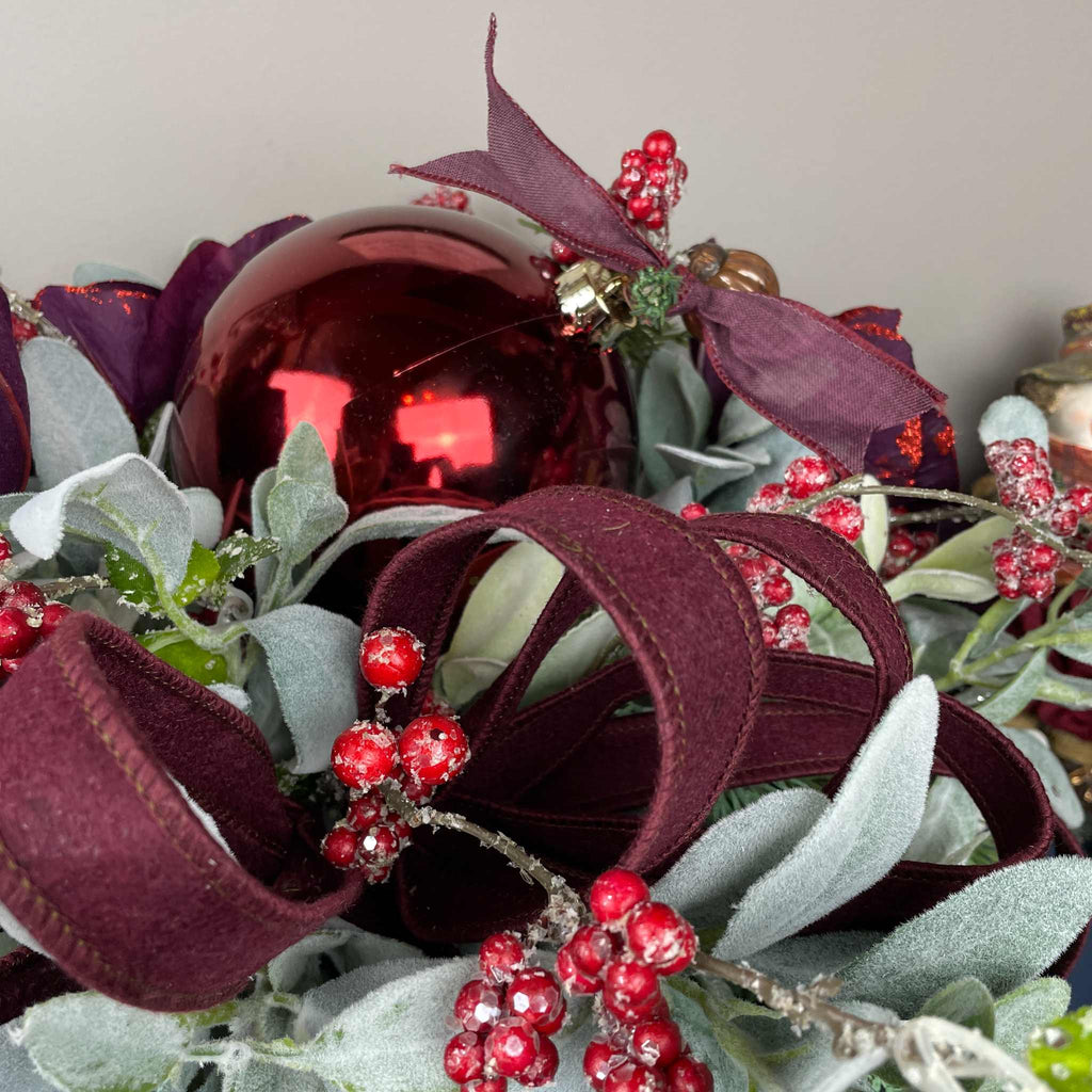 Christmas Centerpiece with Plum Magnolias and Burgundy Ornament Tray
