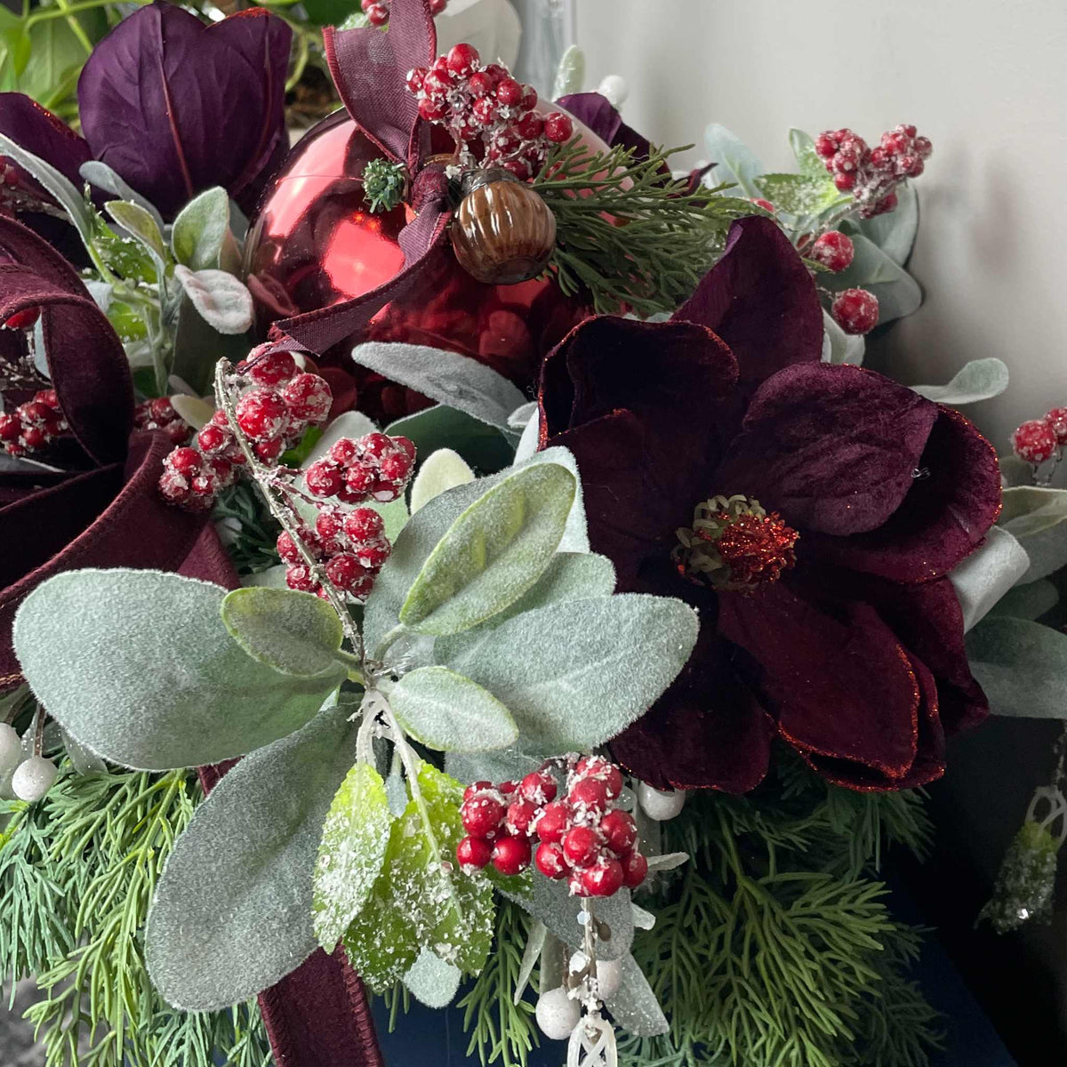 Christmas Centerpiece with Plum Magnolias and Burgundy Ornament Tray
