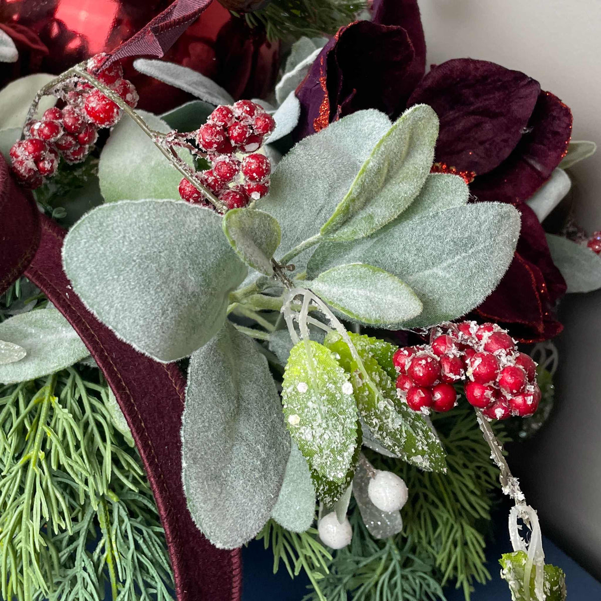 Christmas Centerpiece with Plum Magnolias and Burgundy Ornament Tray