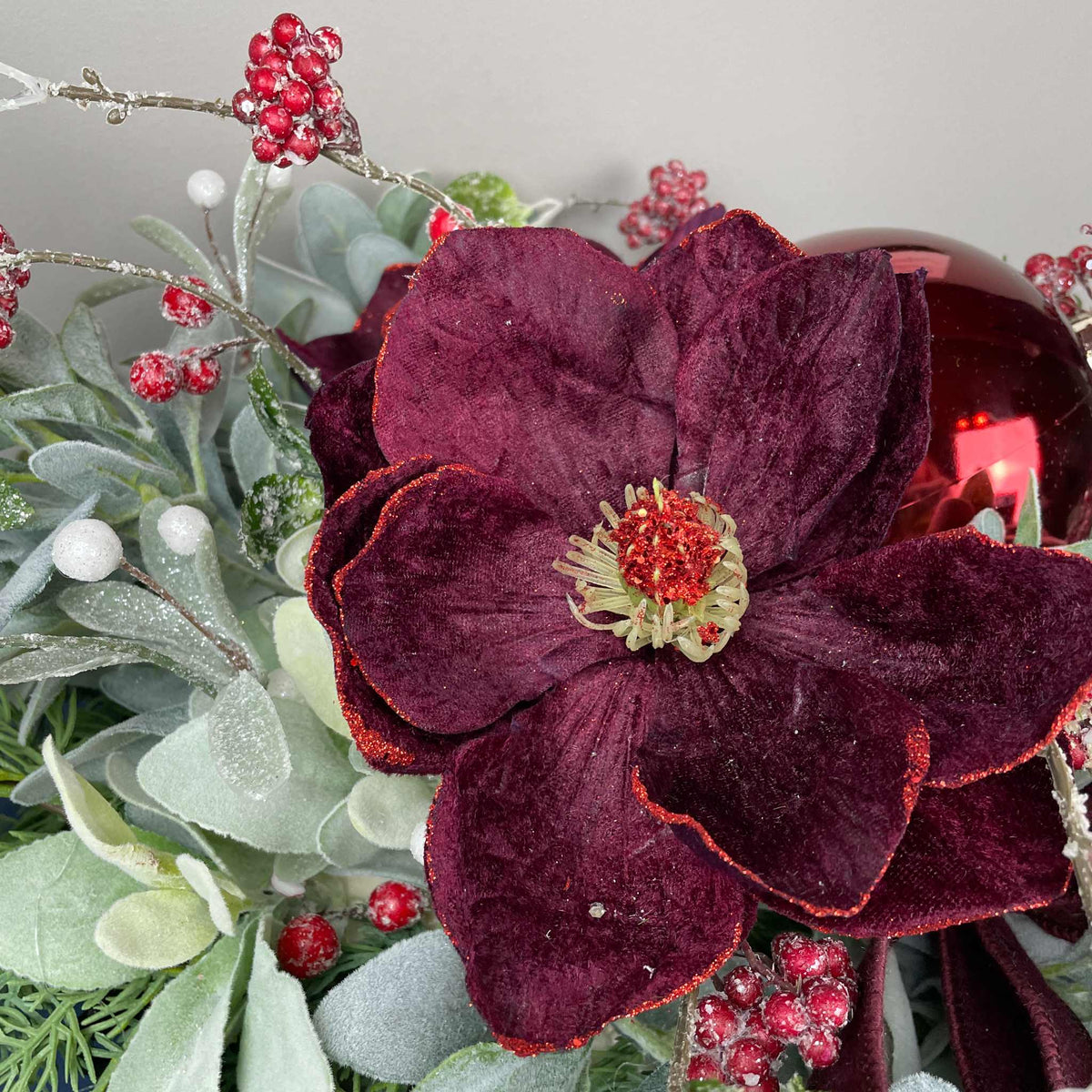 Christmas Centerpiece with Plum Magnolias and Burgundy Ornament Tray