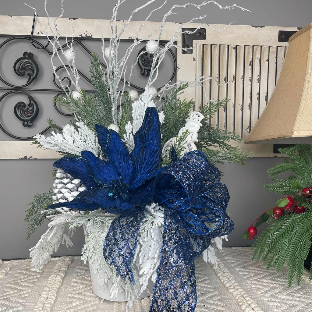 Winter Blue Poinsettia Centerpiece with Snowy Cedar & Snowflake Pail