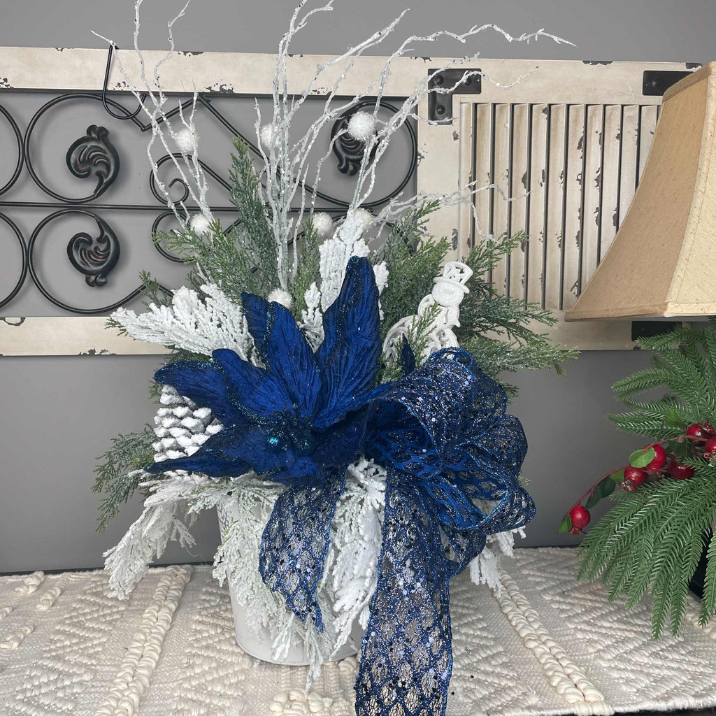 Winter Blue Poinsettia Centerpiece with Snowy Cedar & Snowflake Pail