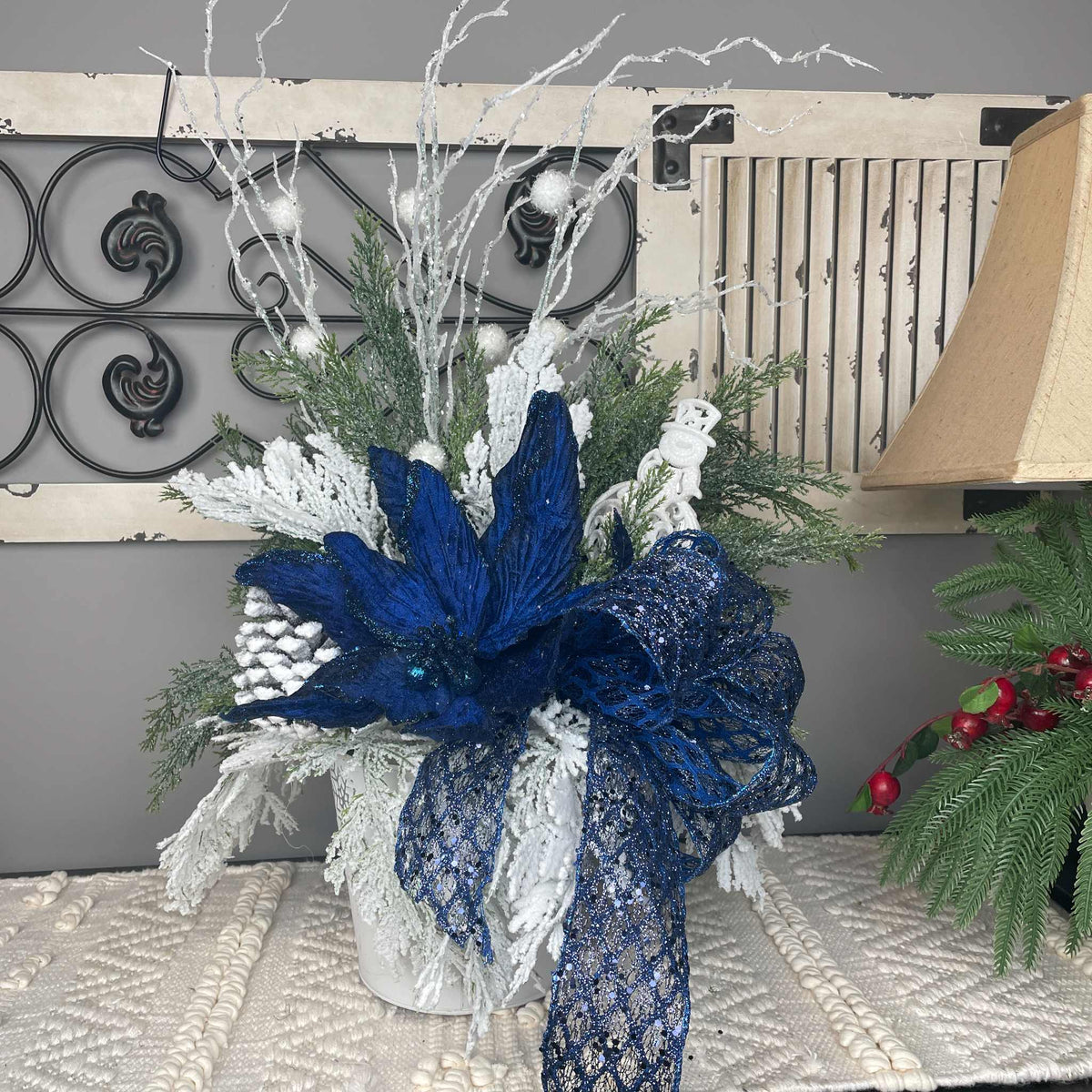 Winter Blue Poinsettia Centerpiece with Snowy Cedar & Snowflake Pail