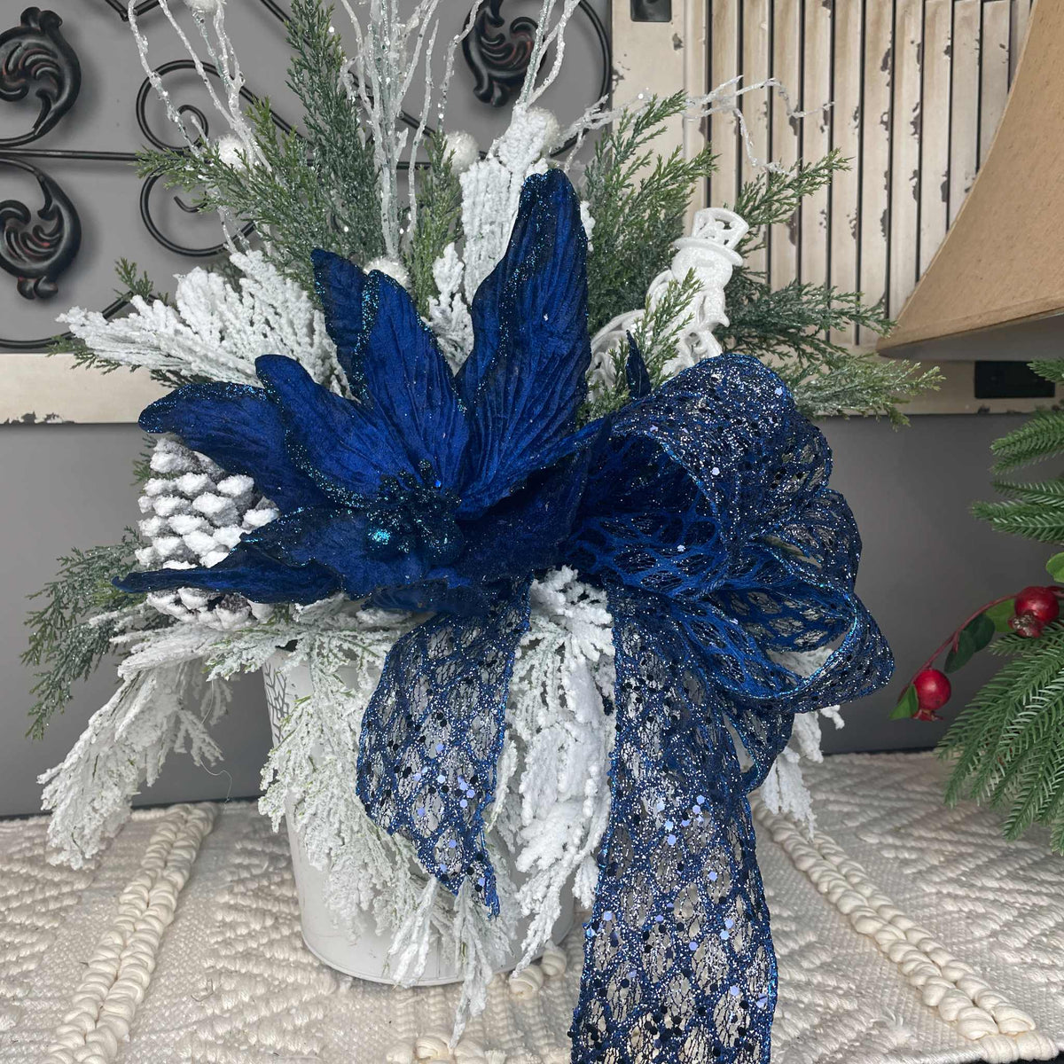 Winter Blue Poinsettia Centerpiece with Snowy Cedar & Snowflake Pail