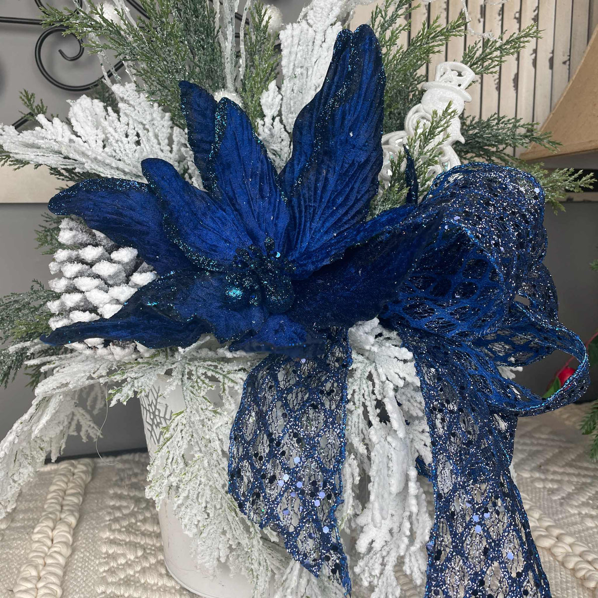 Winter Blue Poinsettia Centerpiece with Snowy Cedar & Snowflake Pail