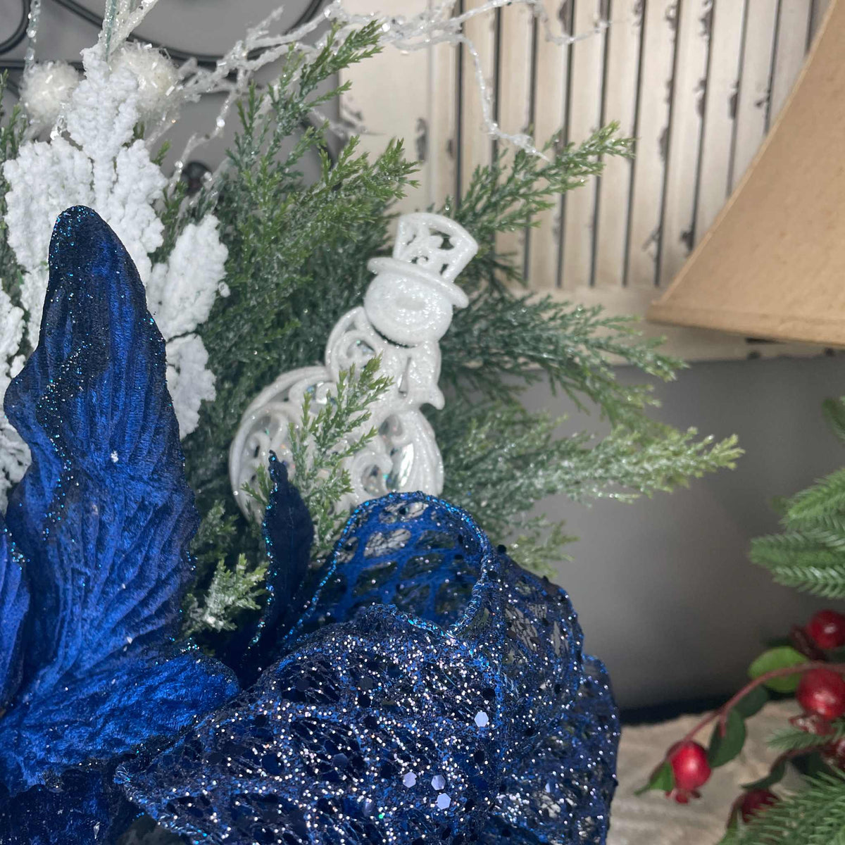 Winter Blue Poinsettia Centerpiece with Snowy Cedar & Snowflake Pail