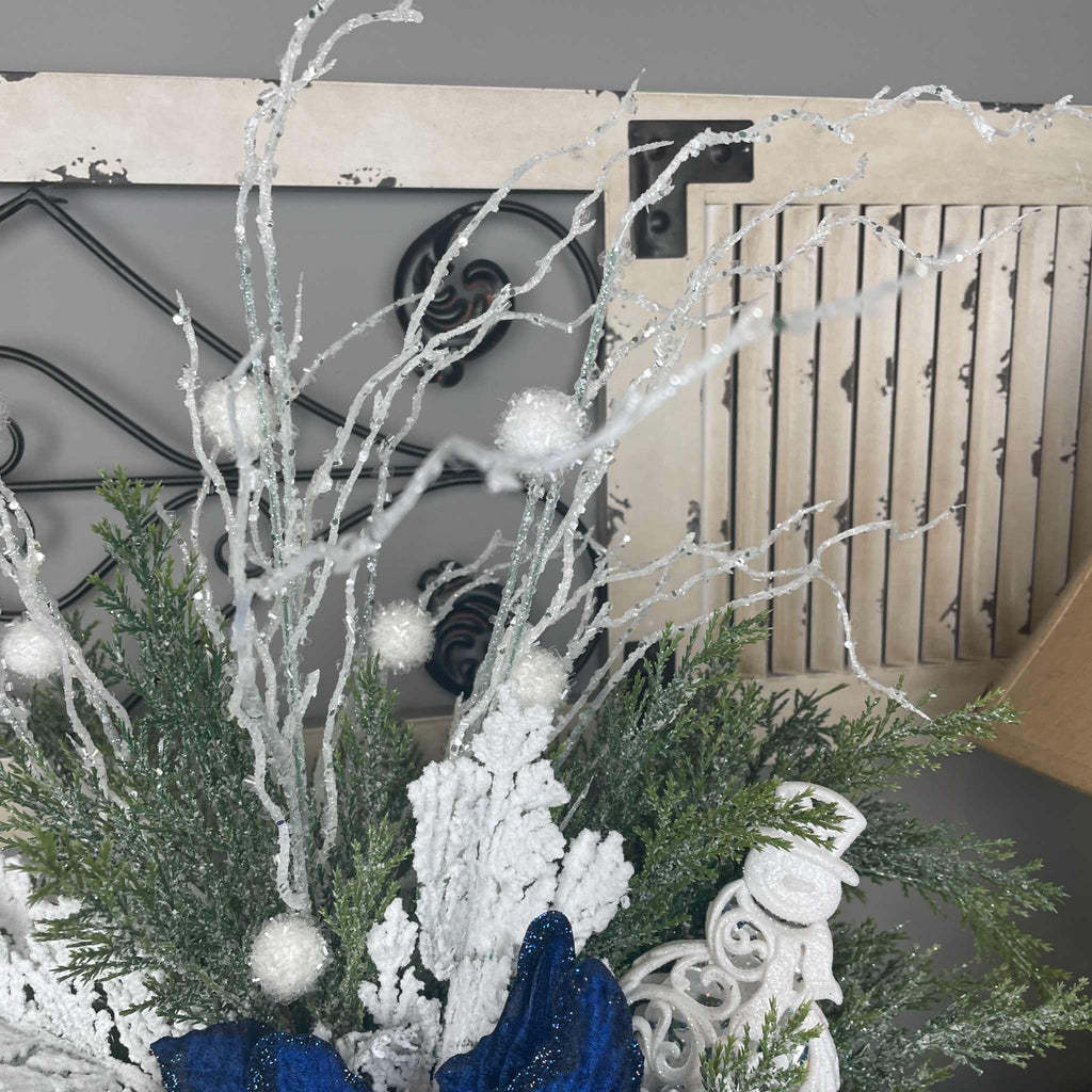 Winter Blue Poinsettia Centerpiece with Snowy Cedar & Snowflake Pail