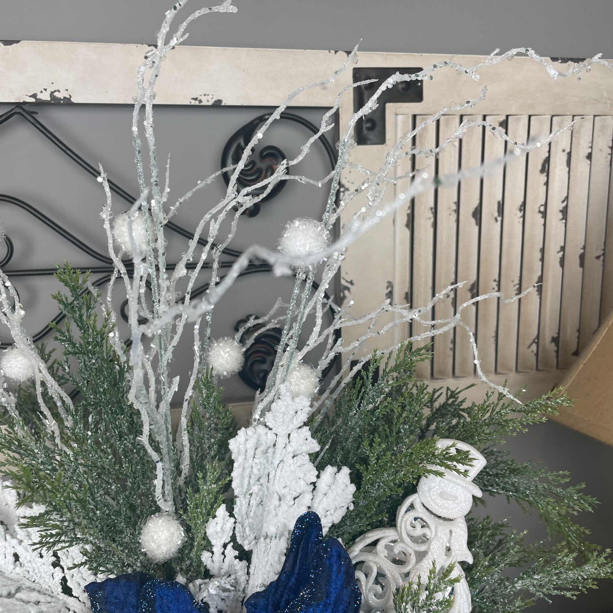 Winter Blue Poinsettia Centerpiece with Snowy Cedar & Snowflake Pail