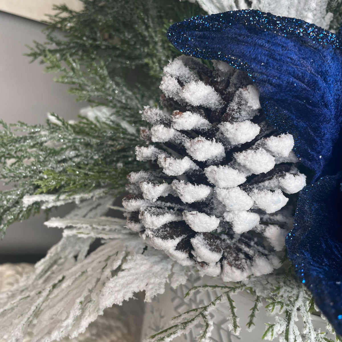 Winter Blue Poinsettia Centerpiece with Snowy Cedar & Snowflake Pail