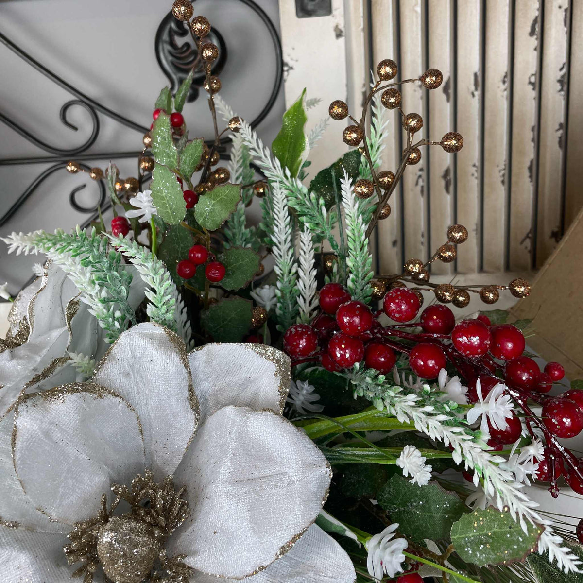 Christmas Magnolia Arrangement in Black Metal Vase White & Red Florals