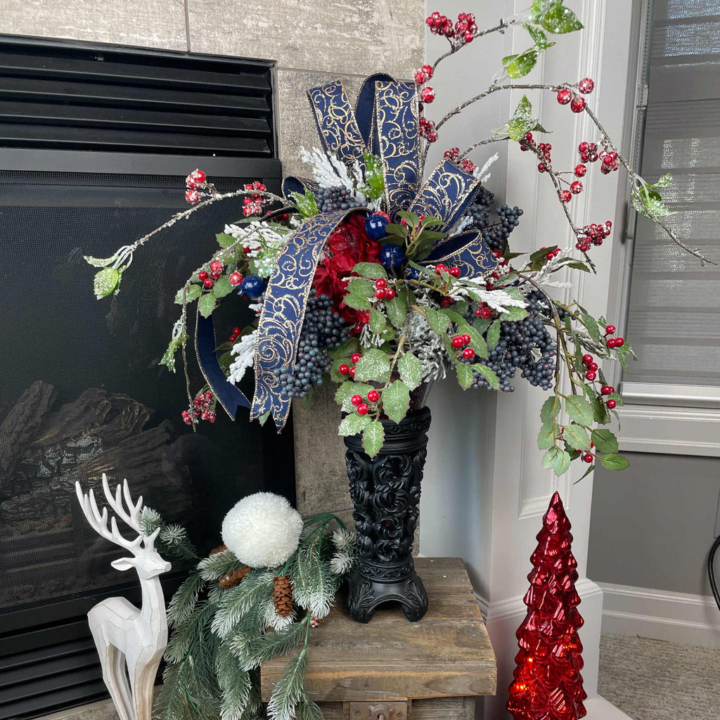Christmas Floral Centerpiece with Iced Berries & Navy Blue Bow in Cast Iron Vase