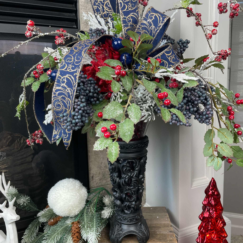 Christmas Floral Centerpiece with Iced Berries & Navy Blue Bow in Cast Iron Vase