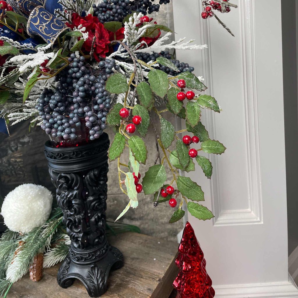 Christmas Floral Centerpiece with Iced Berries & Navy Blue Bow in Cast Iron Vase