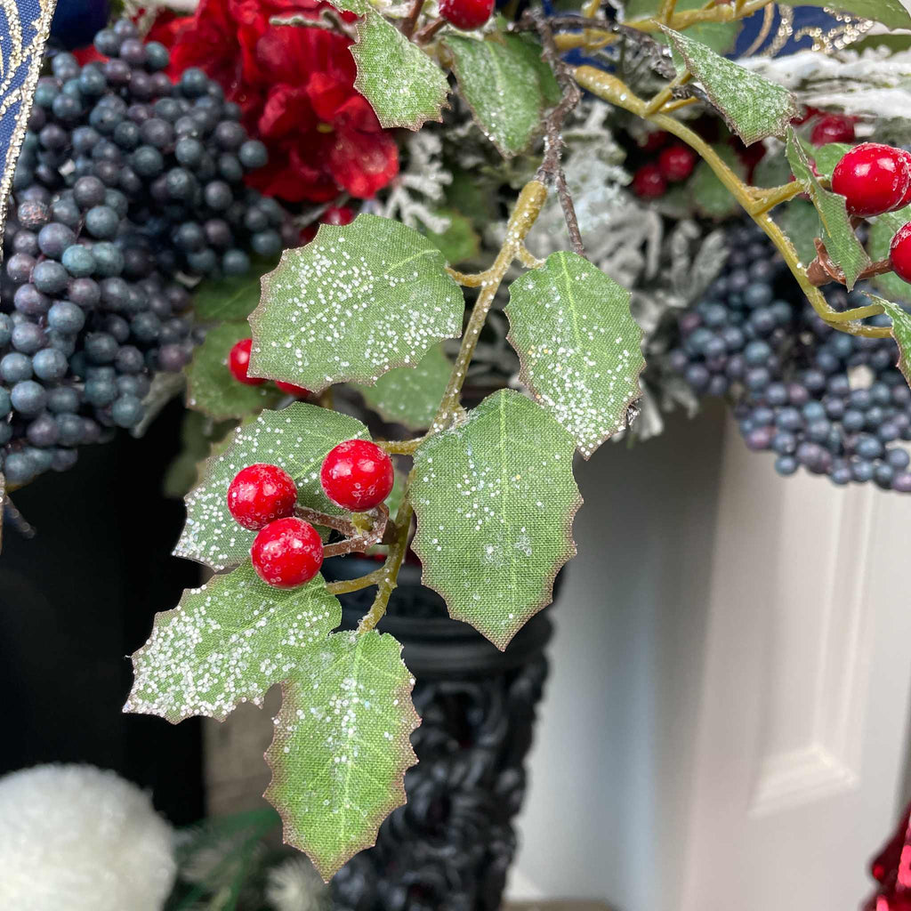 Christmas Floral Centerpiece with Iced Berries & Navy Blue Bow in Cast Iron Vase