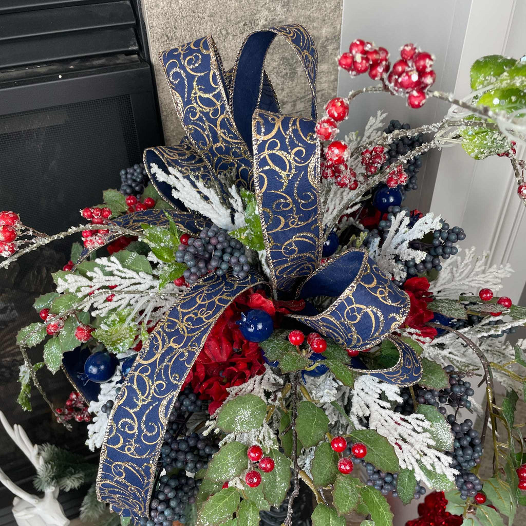 Christmas Floral Centerpiece with Iced Berries & Navy Blue Bow in Cast Iron Vase