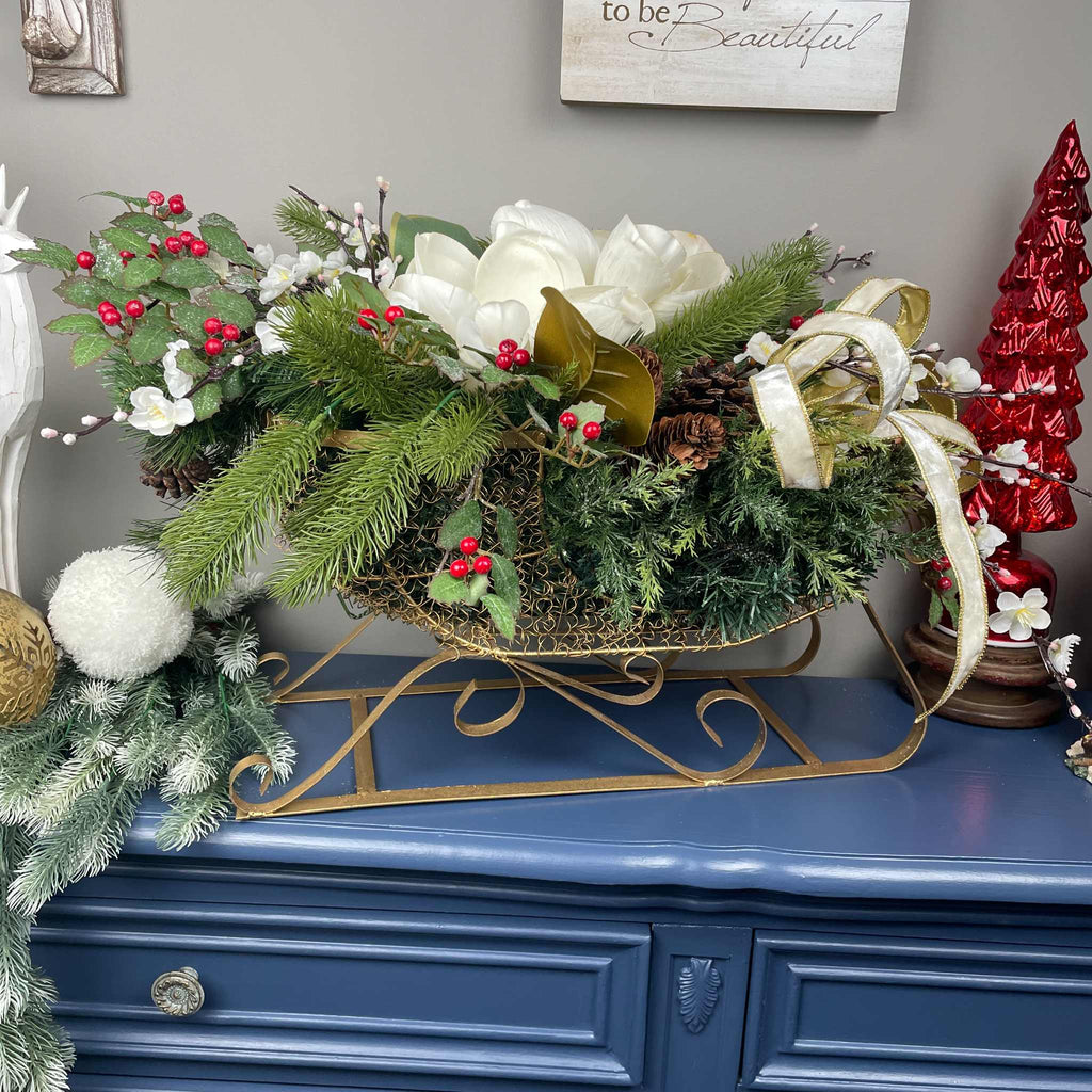Christmas Metal Sleigh Centerpiece with Cream Magnolias & Holly