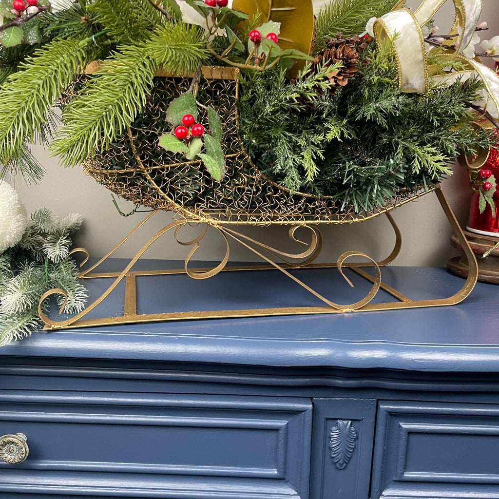 Christmas Metal Sleigh Centerpiece with Cream Magnolias & Holly