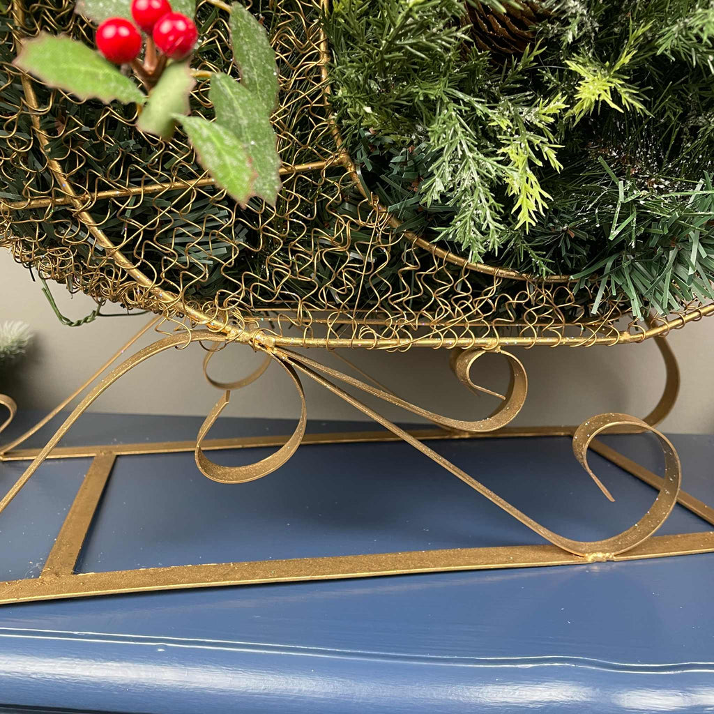 Christmas Metal Sleigh Centerpiece with Cream Magnolias & Holly