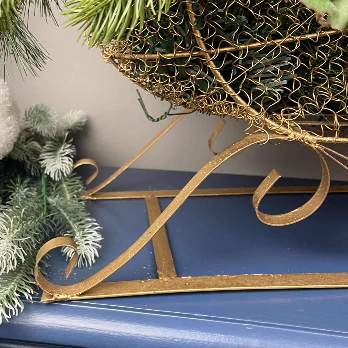 Christmas Metal Sleigh Centerpiece with Cream Magnolias & Holly