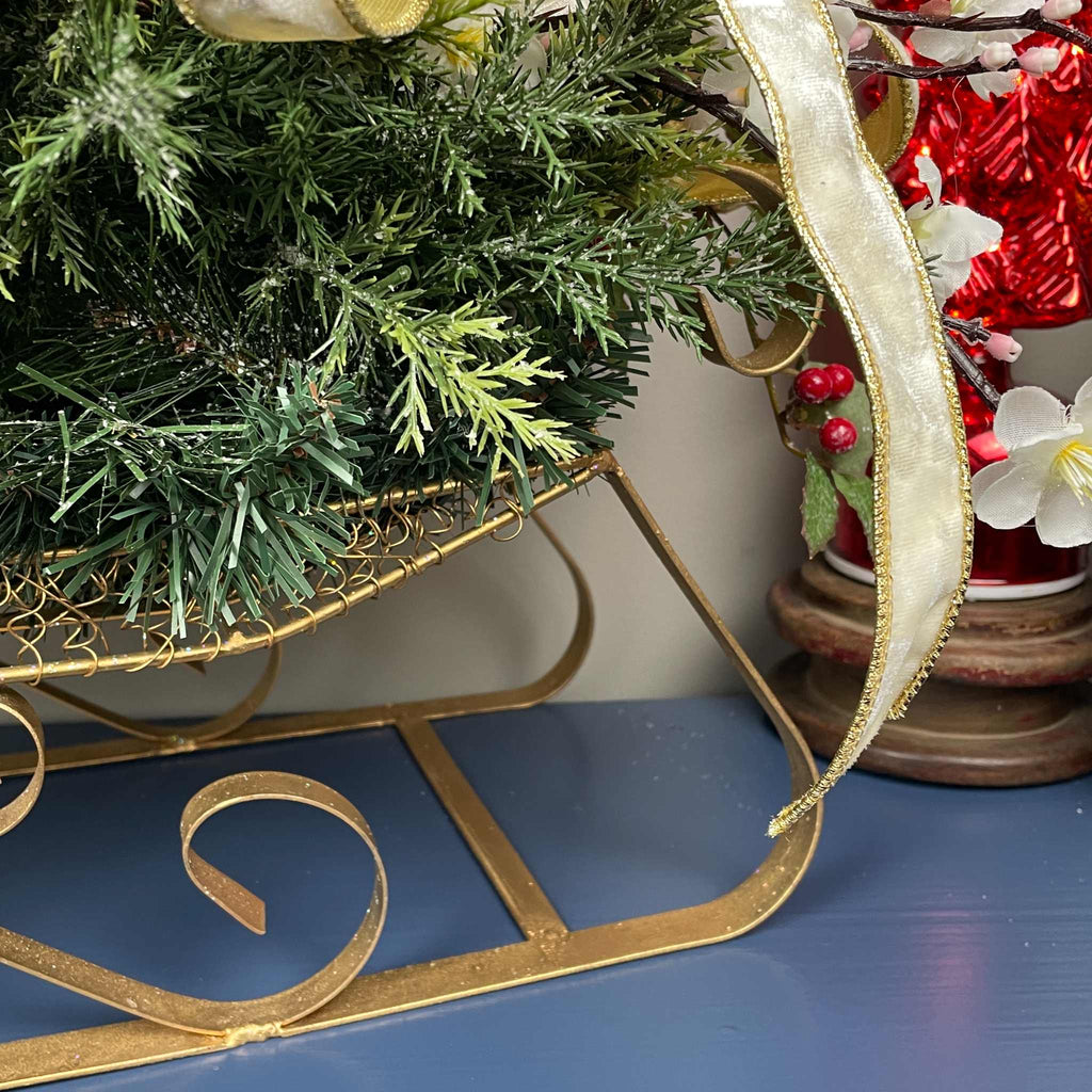 Christmas Metal Sleigh Centerpiece with Cream Magnolias & Holly