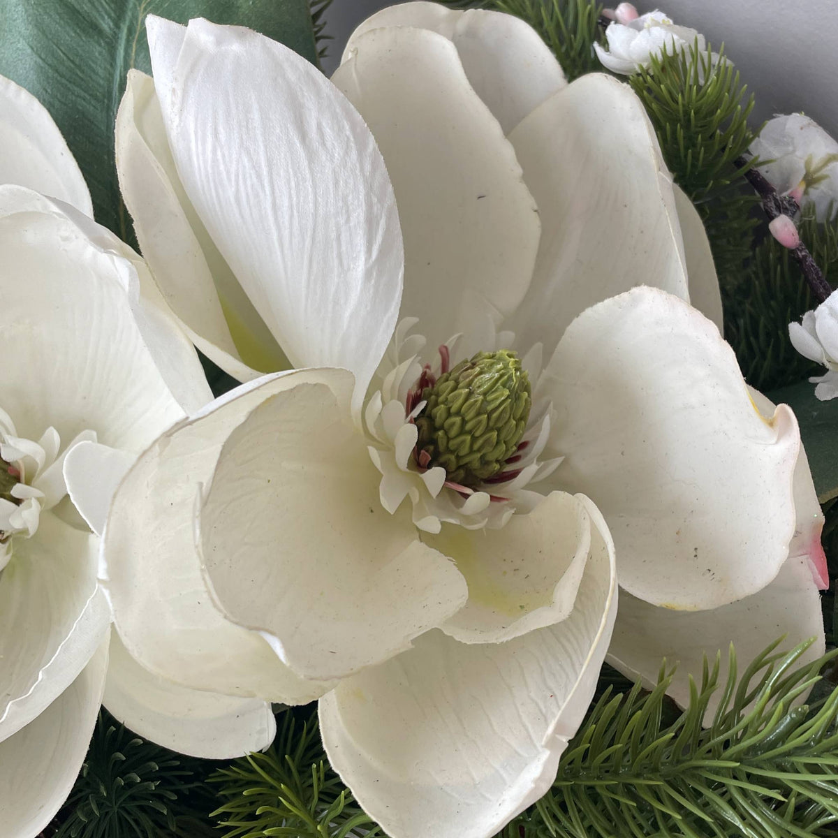 Christmas Metal Sleigh Centerpiece with Cream Magnolias & Holly