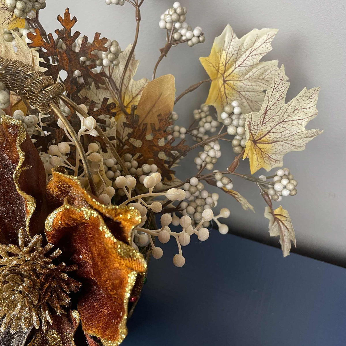 Bronze Magnolia Christmas Arrangement in Gold Metal Basket with Handle