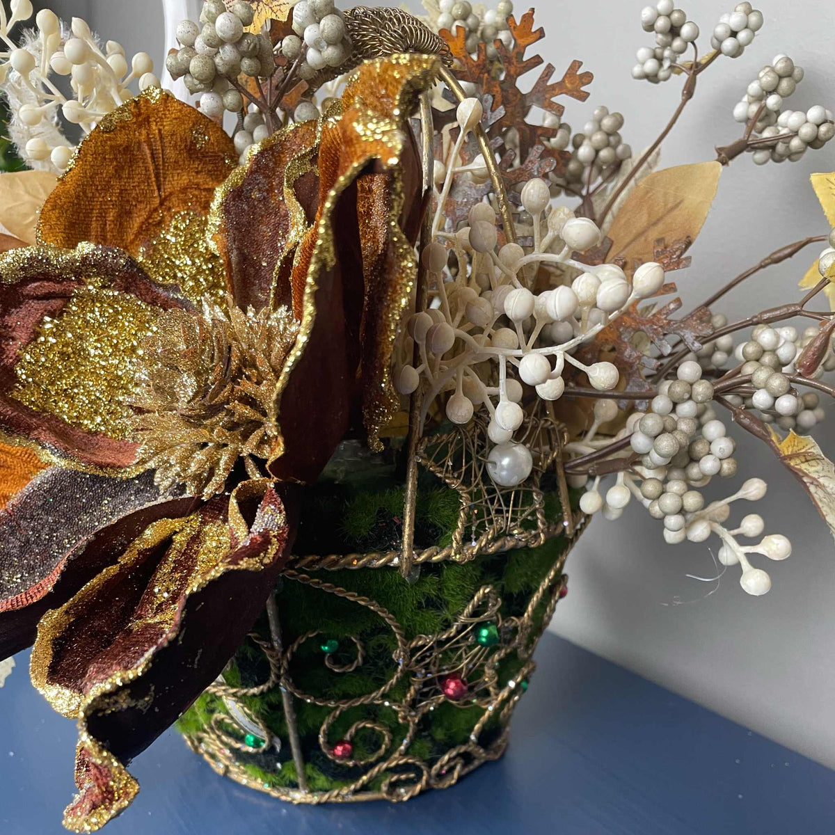 Bronze Magnolia Christmas Arrangement in Gold Metal Basket with Handle
