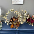 Bronze Magnolia Centerpiece with Cream Flowers & Silver Rings