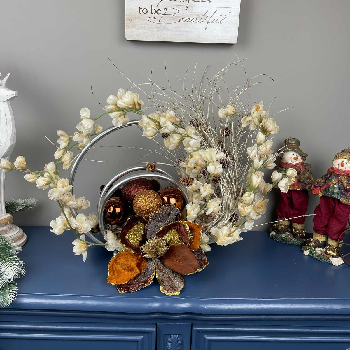 Bronze Magnolia Centerpiece with Cream Flowers & Silver Rings