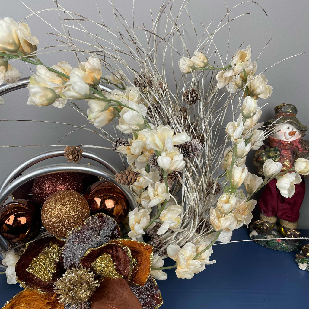 Bronze Magnolia Centerpiece with Cream Flowers & Silver Rings