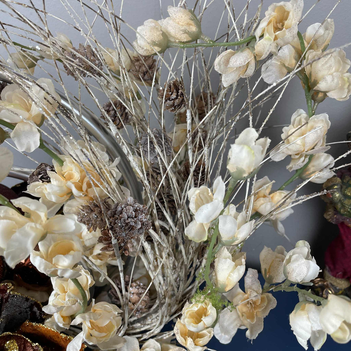 Bronze Magnolia Centerpiece with Cream Flowers & Silver Rings