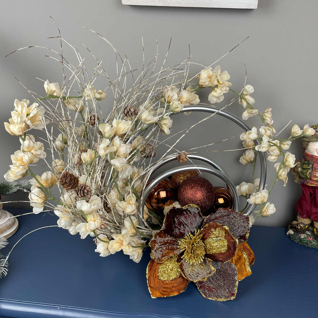 Bronze Magnolia Centerpiece with Cream Flowers & Silver Rings