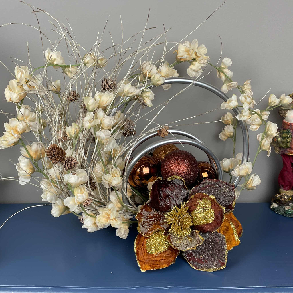 Bronze Magnolia Centerpiece with Cream Flowers & Silver Rings